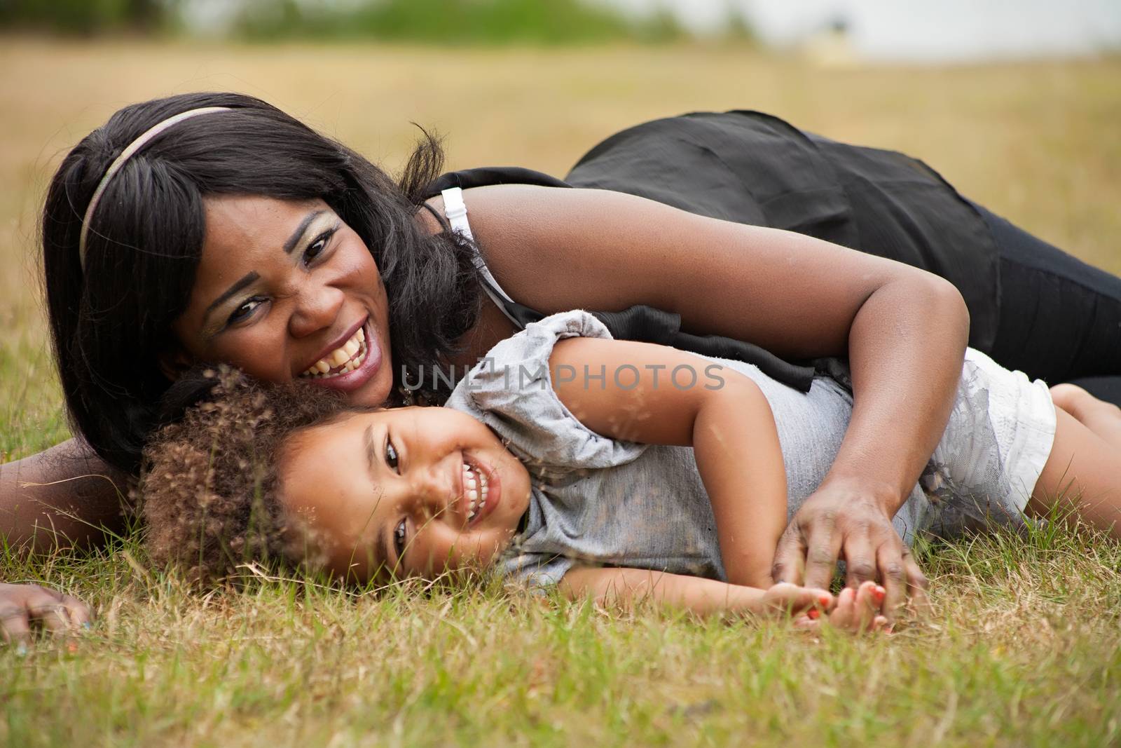 Pregnant mother and her daughter are having fun