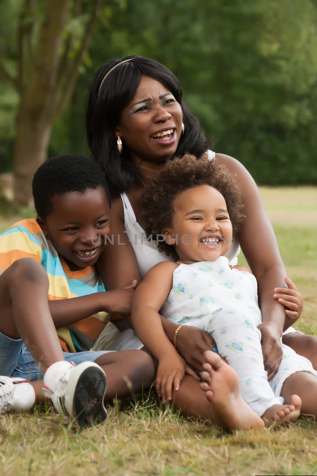 African mother and her kids are having fun in the nature