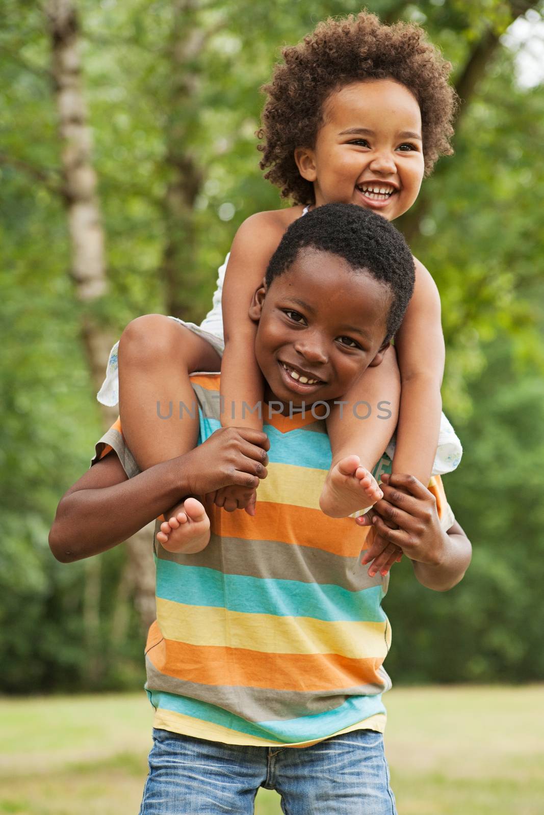 african brother and sister having fun in nature