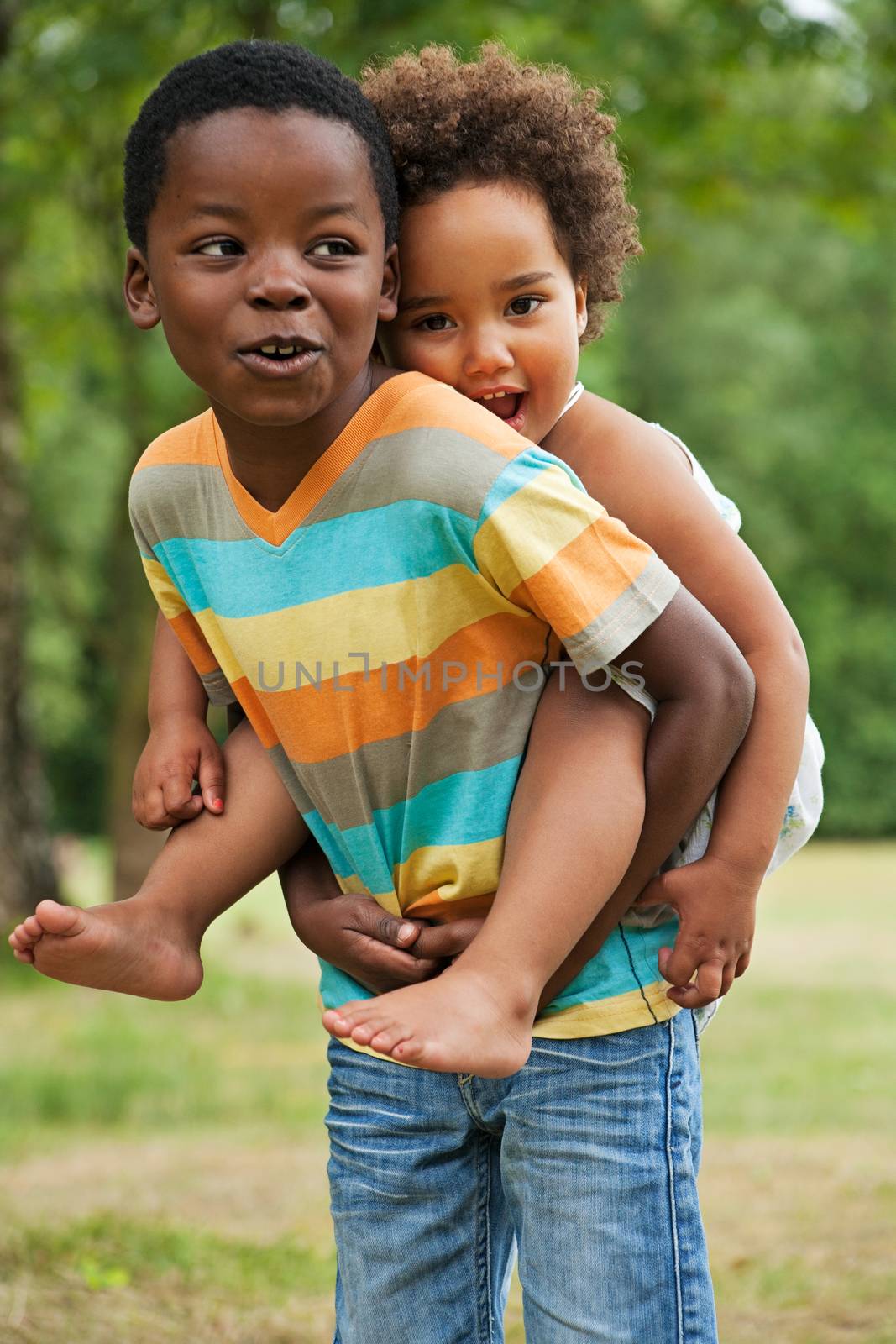 african brother and sister having fun in nature