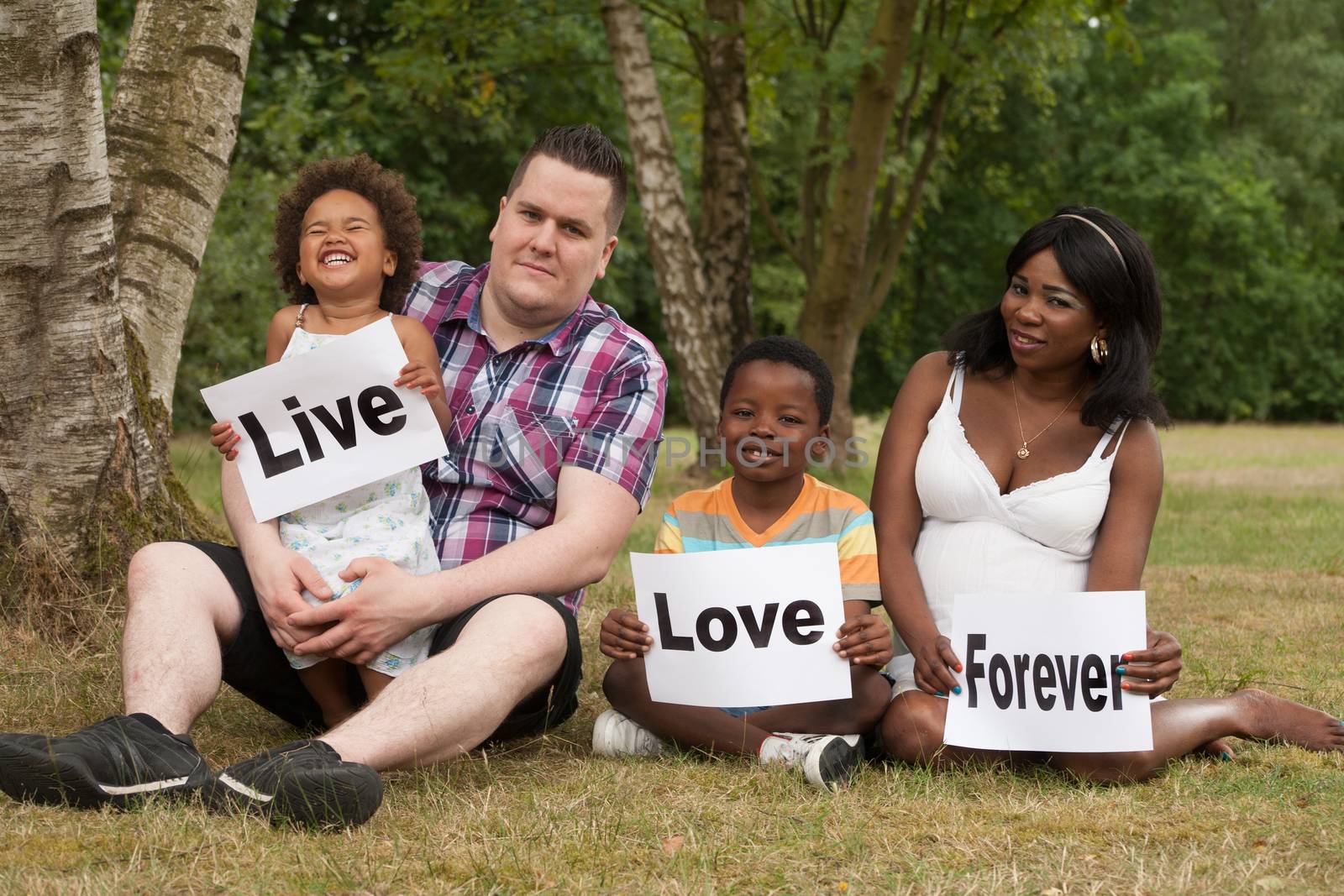 African multicultural family is holding white boards 