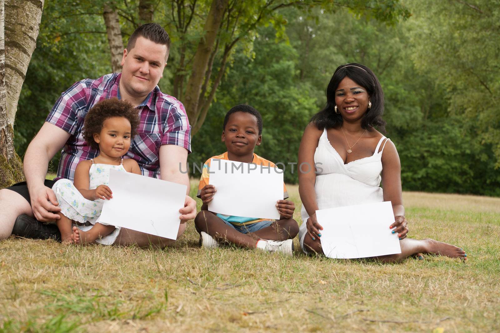 African multicultural family is holding white boards 