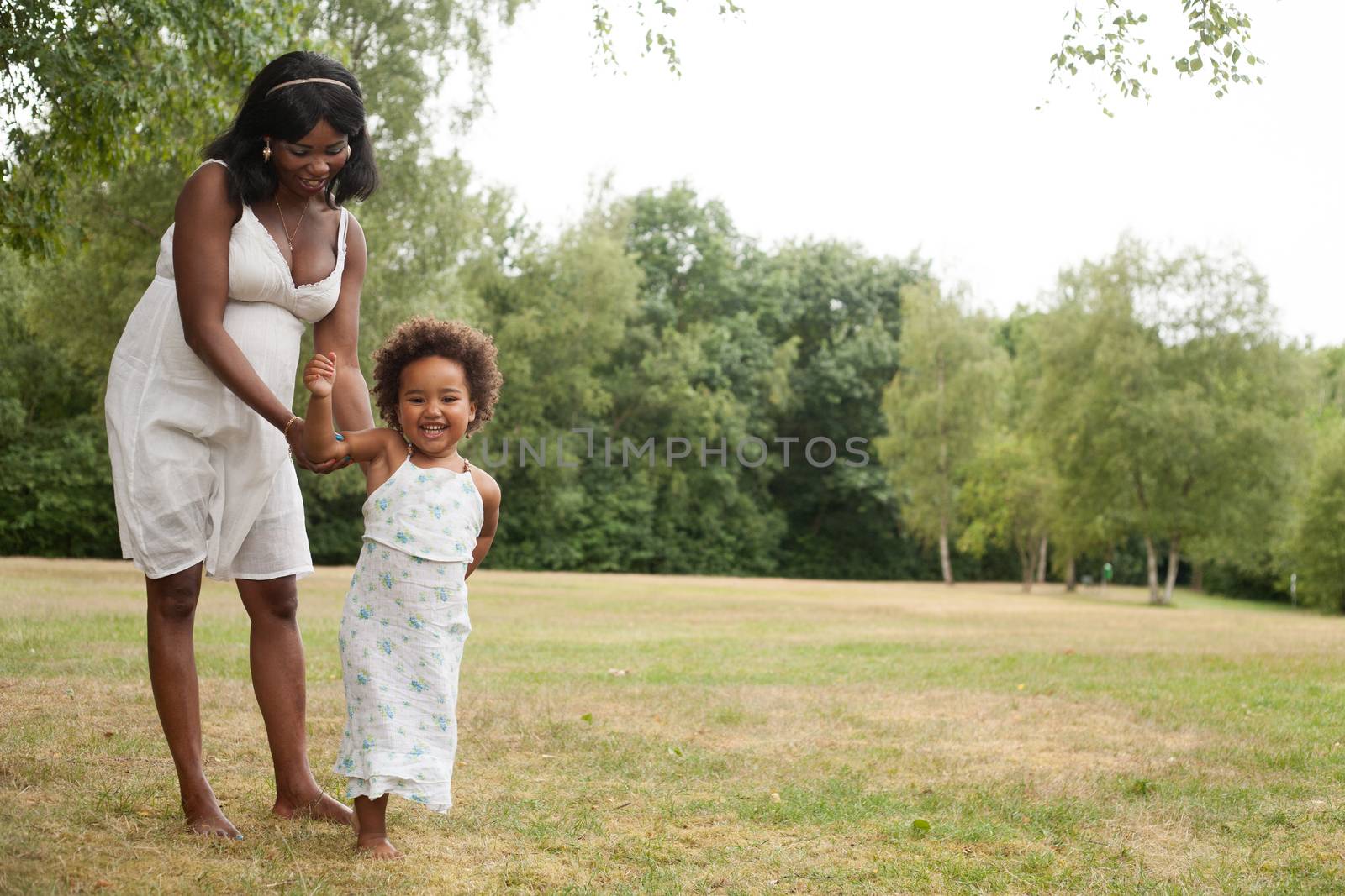 African girl and mother are having fun by DNFStyle