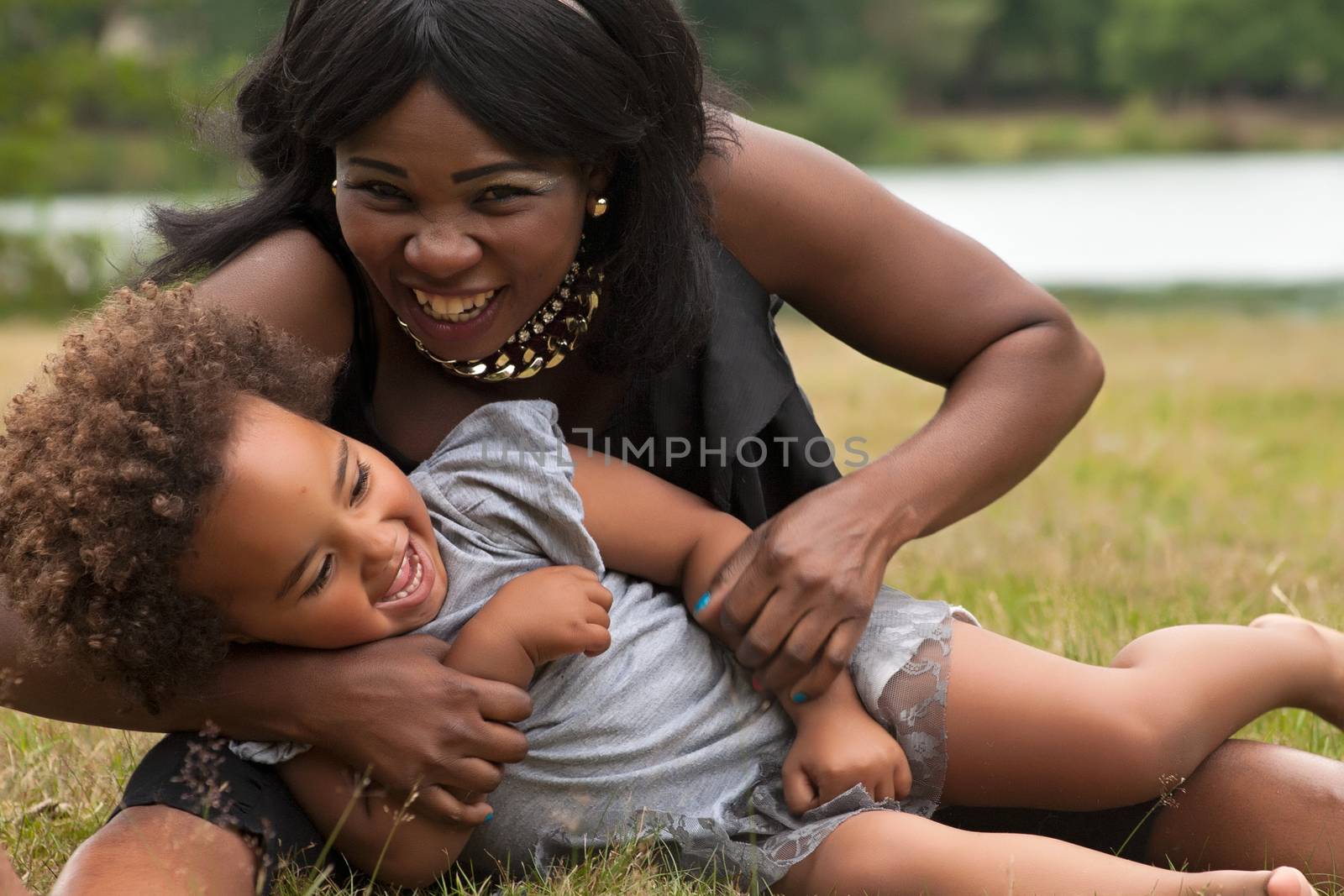 African mother is playing with her girl by DNFStyle