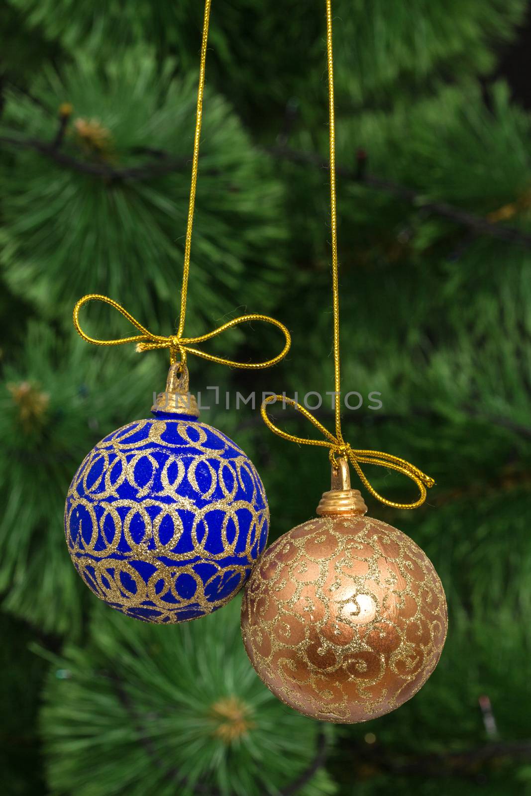 Beautiful Christmas balls on  background of green fir-tree