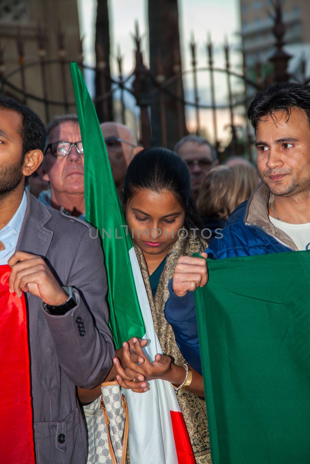 ITALY, Palermo: Italians light candles and stand in solidarity with the victims of the Paris attacks in the main square of Palermo on November 14, 2015. 