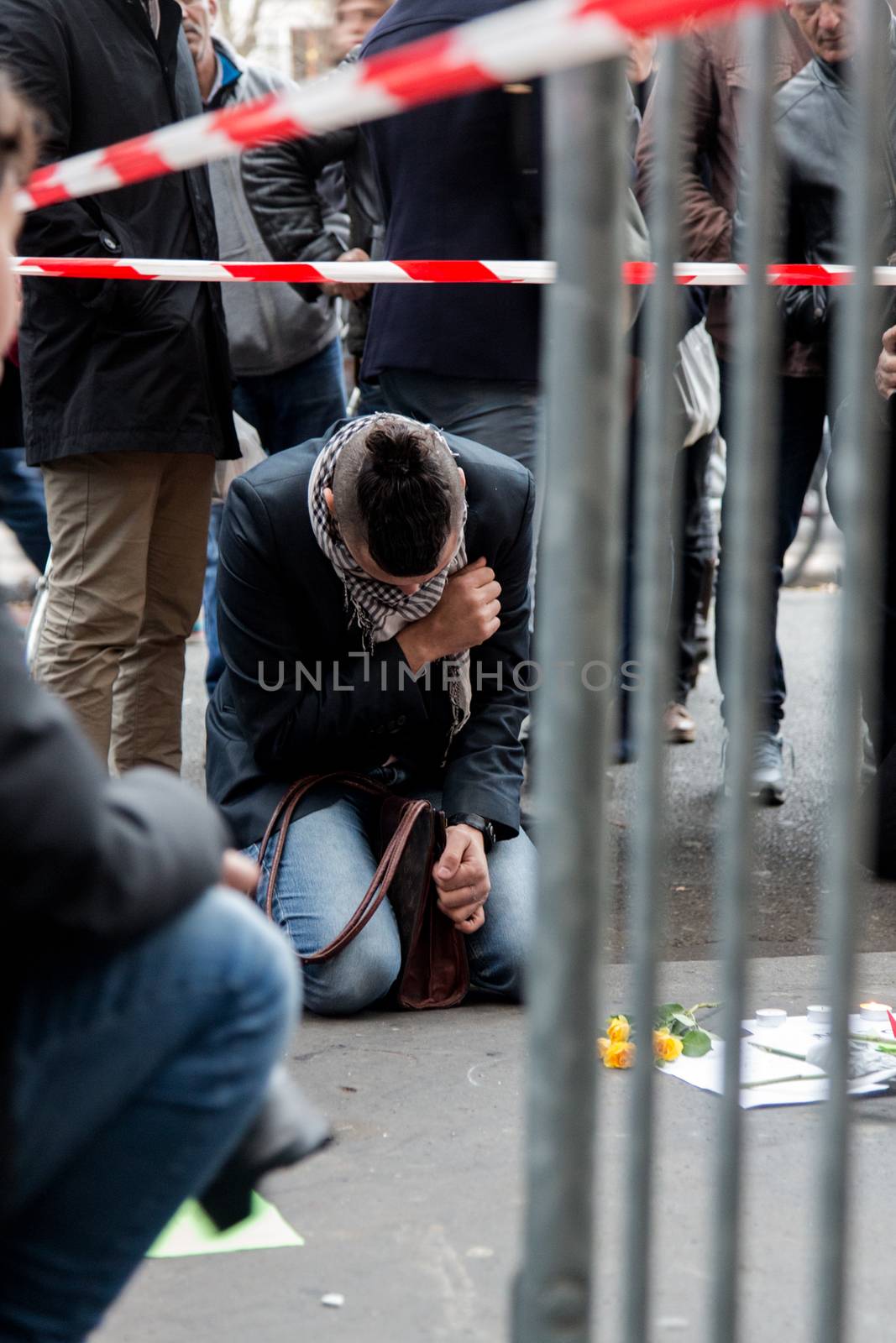 FRANCE, Paris: Large crowds leave flowers and other tributes outside the La Casa Nostra pizzeria, the scene of one of several deadly terror attacks in Paris, as part of a citywide outpouring of grief on November 14, 2015. At least 129 people were killed in a series of shootings and explosions carried out the night before by the Islamic State group. 