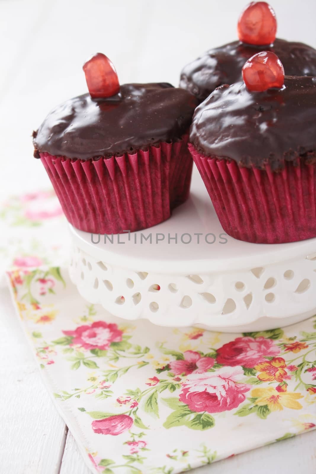 chocolate cup cakes on cake stand