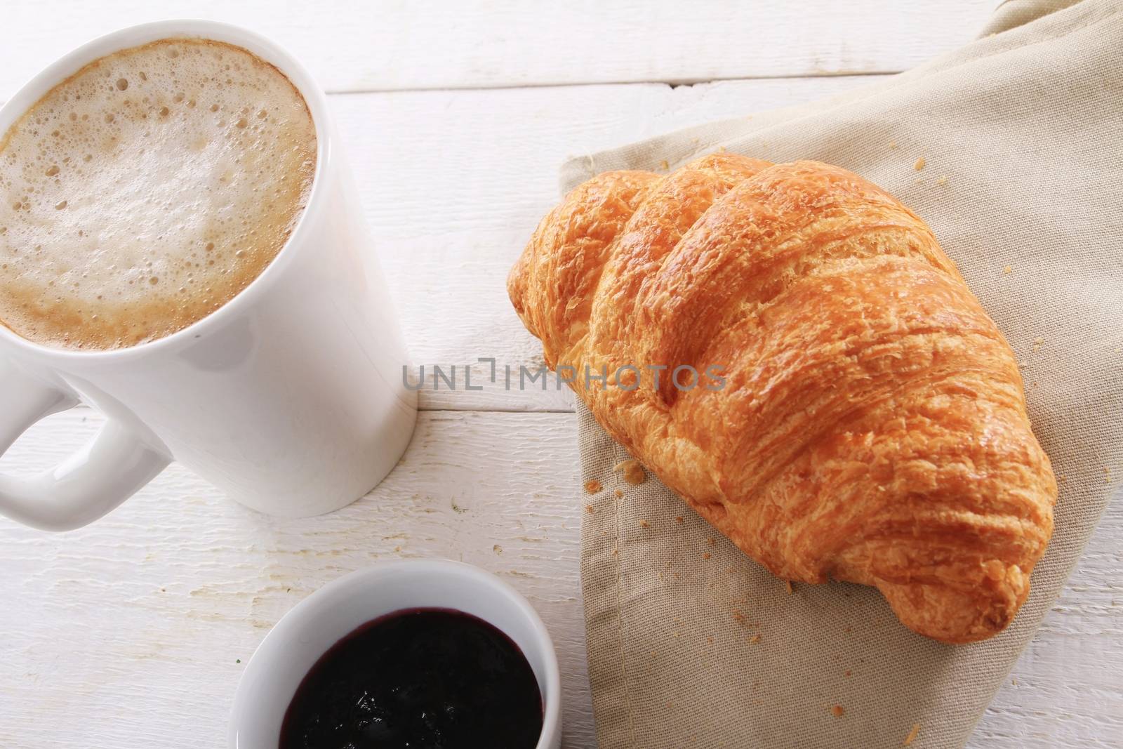 fresh baked croissant with coffee