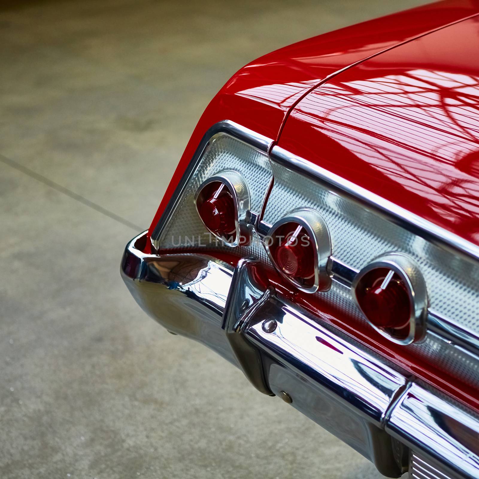 Closeup of the tail lights of a classic car.