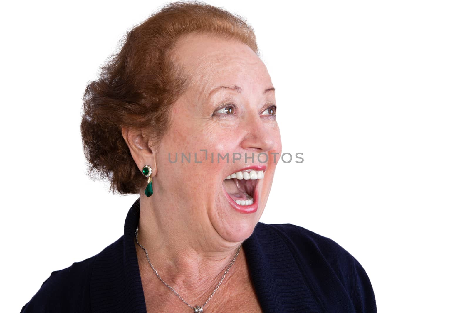 Close up Senior Woman Showing a Surprised Facial Expression with Mouth Open and Looking to the Right of the Frame, Isolated on White Background.