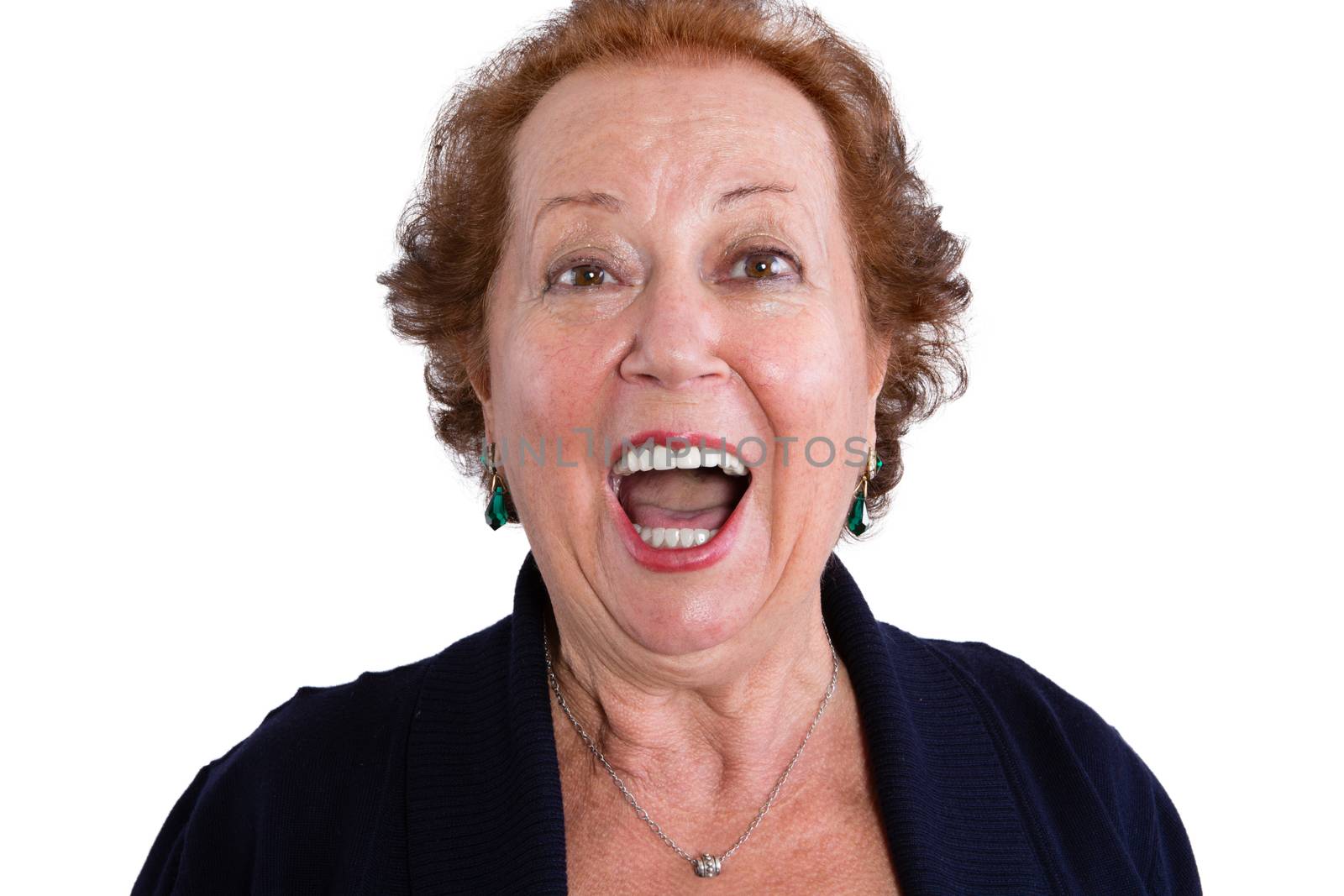 Close up Shocked Face of a Senior Woman Looking at the Camera with Mouth Wide Open, Isolated on White Background.