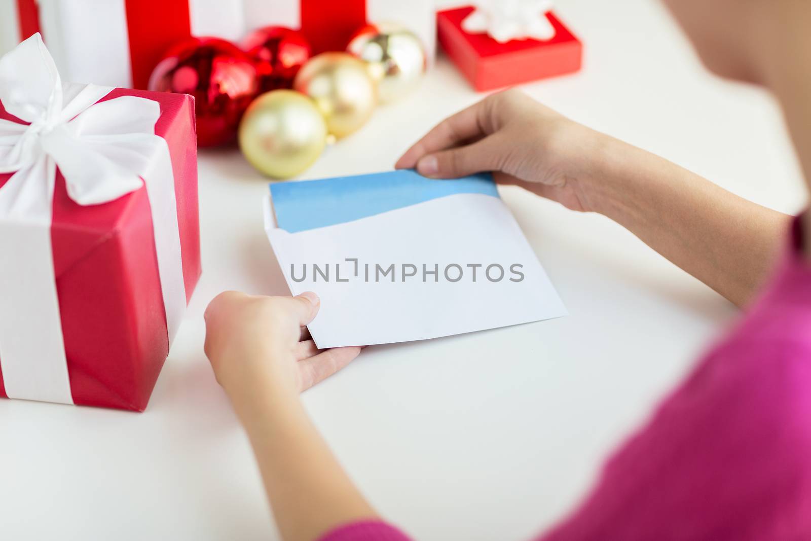 close up of woman with letter and presents by dolgachov