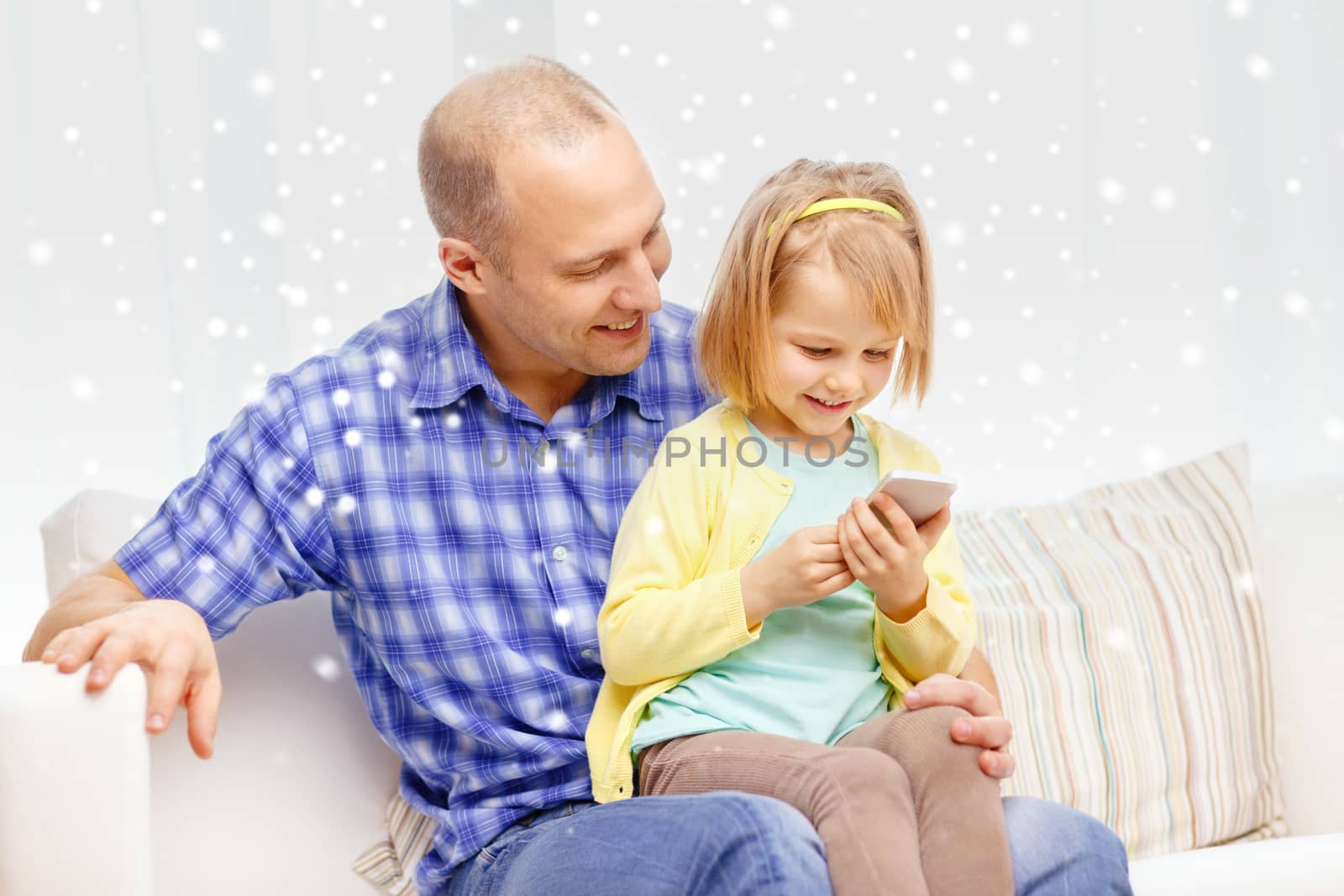 happy father and daughter with smartphone by dolgachov