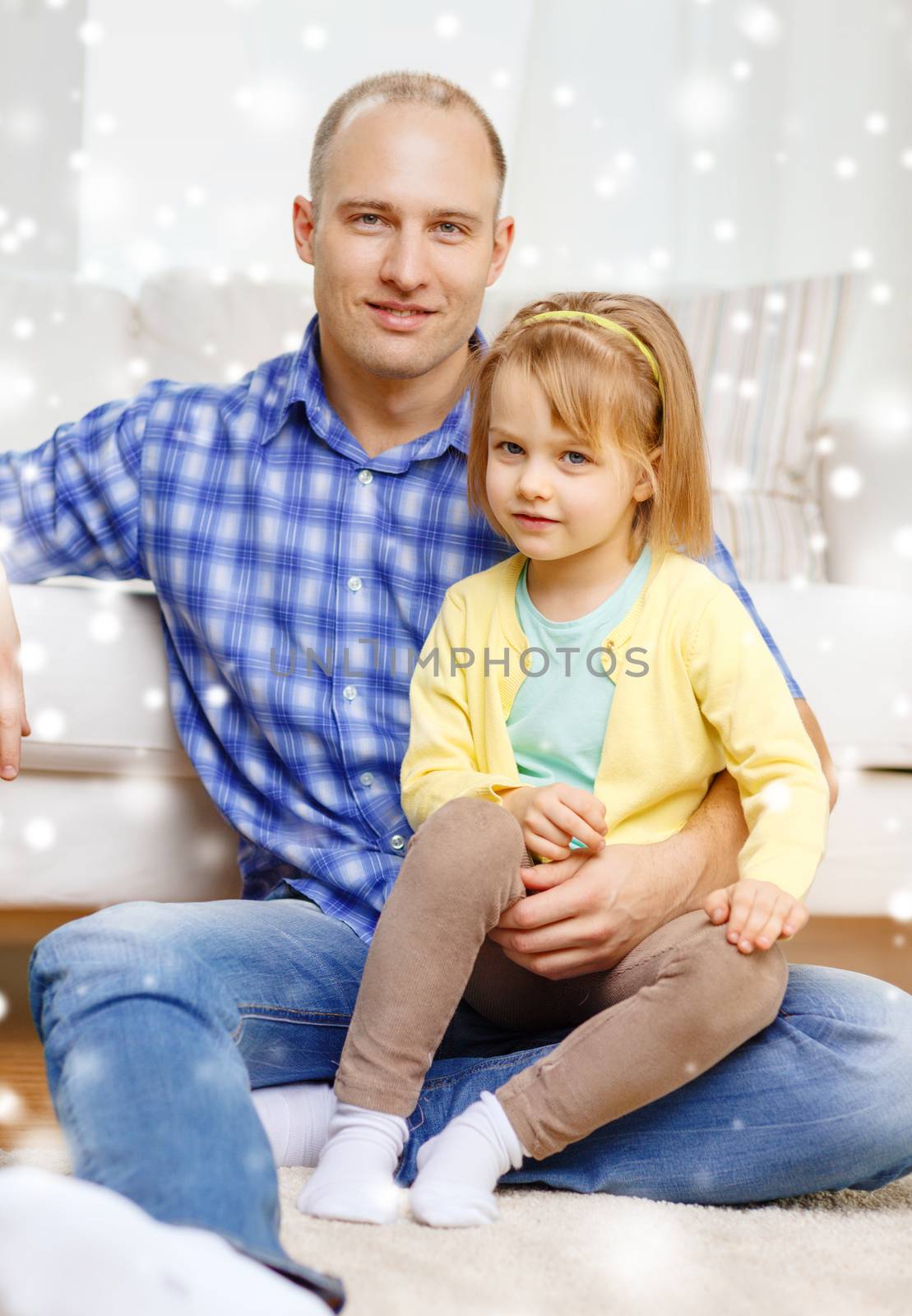 smiling father and daughter hugging at home by dolgachov