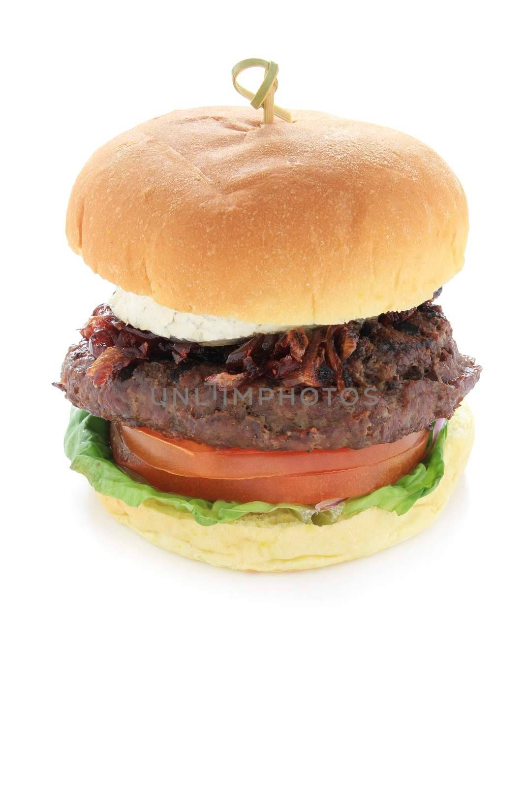 gourmet beefburger with goats cheese isolated