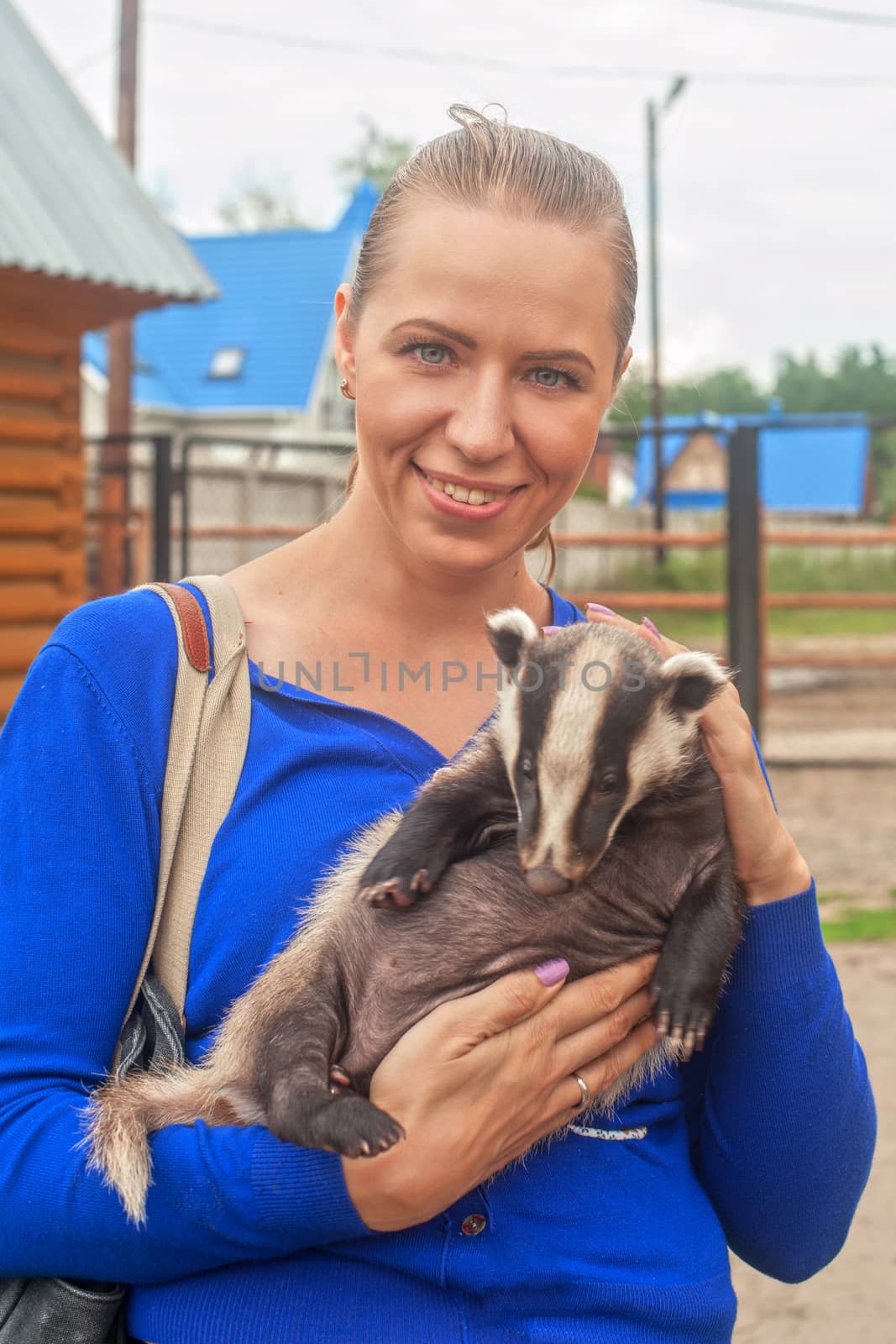 Young attractive woman with badger