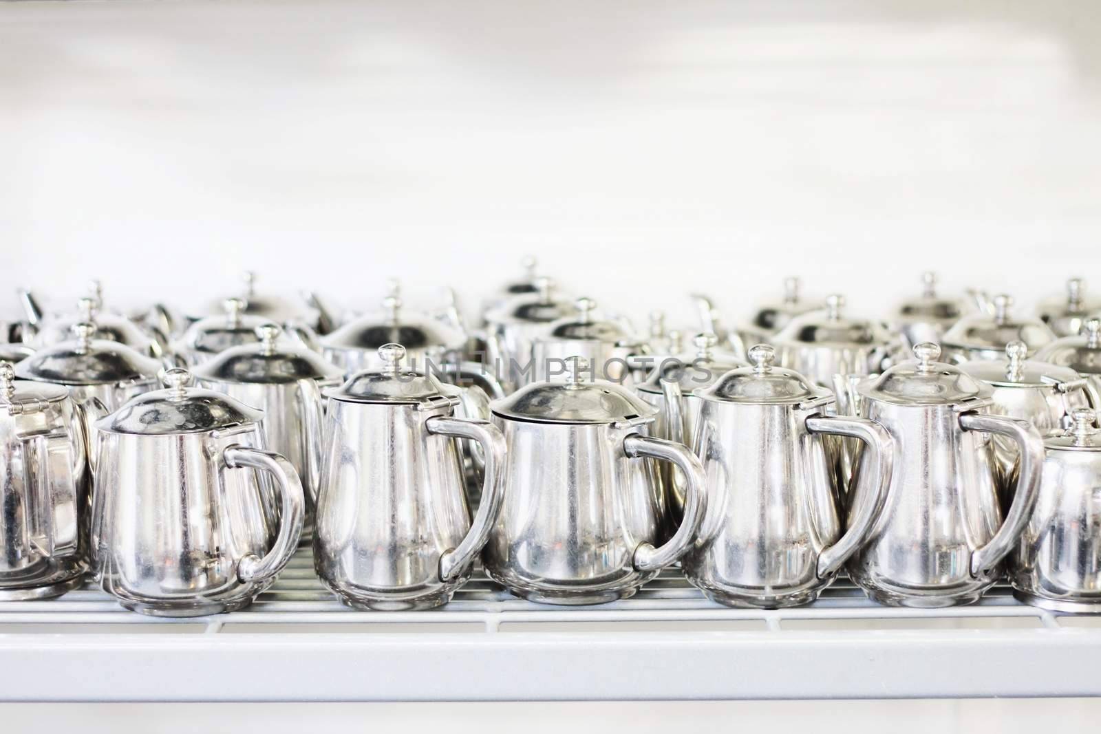 metal teaand coffee pots in commercial kitchen