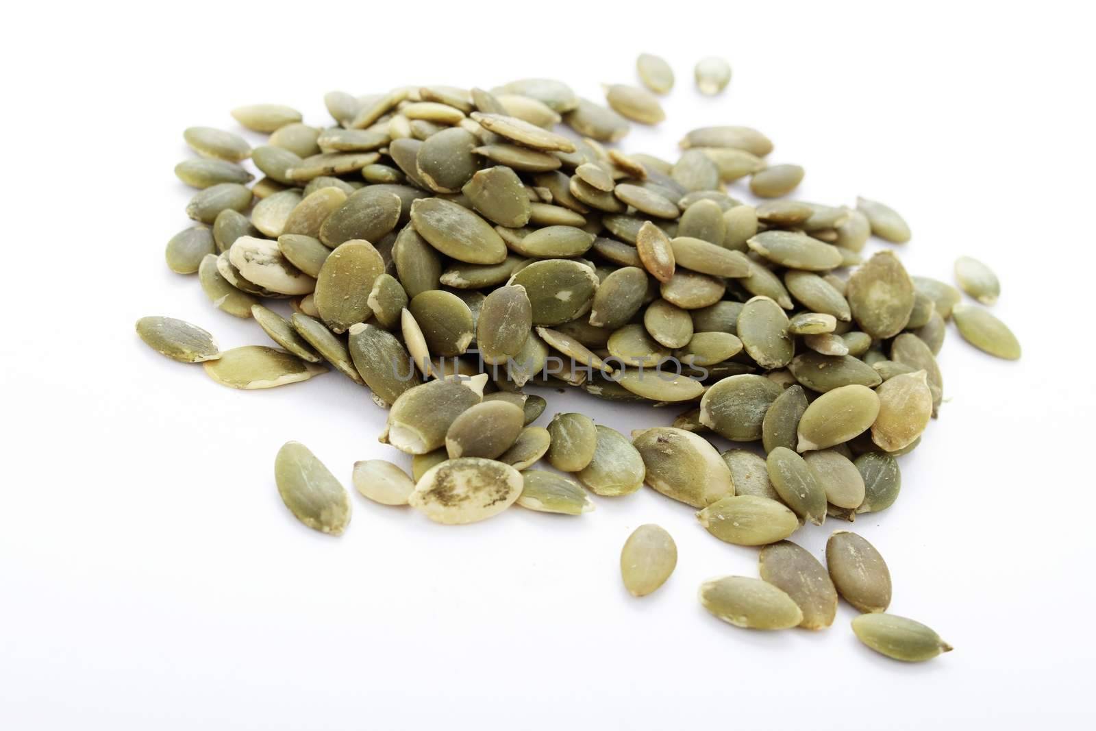 dried pumpkin seeds isolated on white
