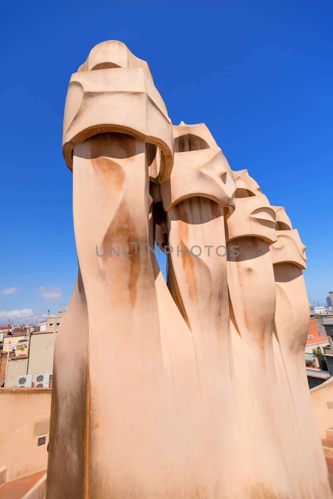 BARCELONA, JULY 19. Gaudi Chimneys statues at Casa Mila (also called La Pedrera) on July 19, 2012 in Barcelona. Terrace of the Casa Mila, with chimneys shaped anthropomorphic soldiers, created by Gaudi.