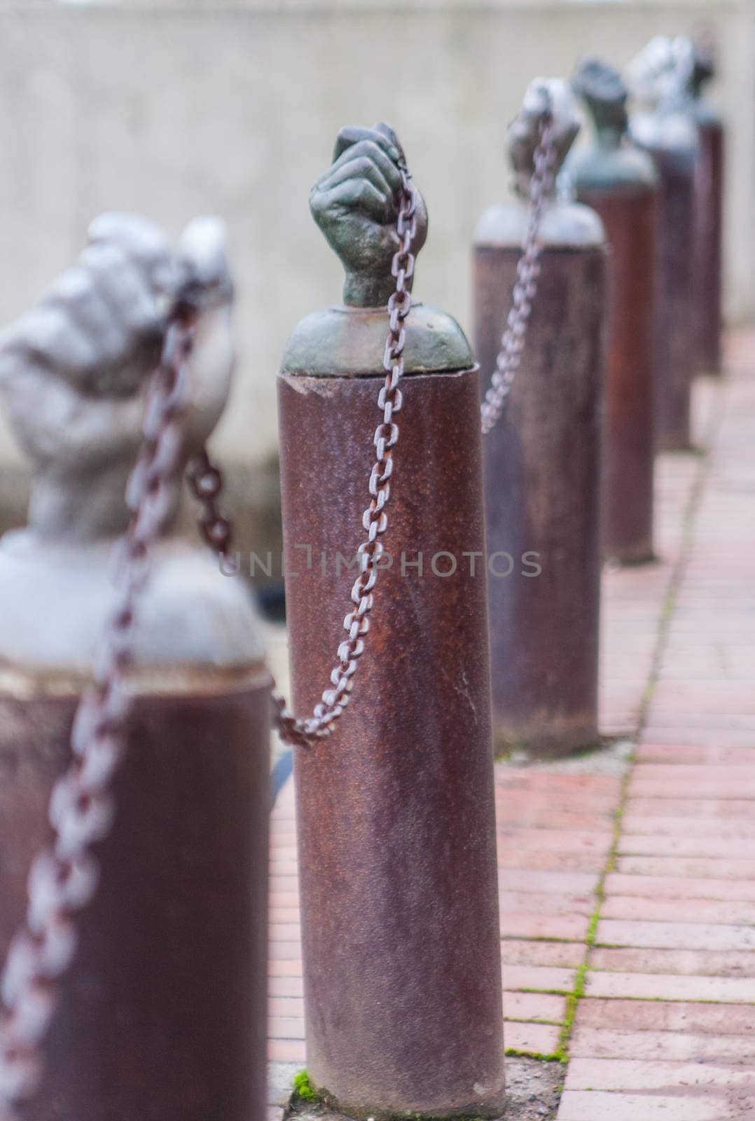 Hands holding a security chain by johnborda