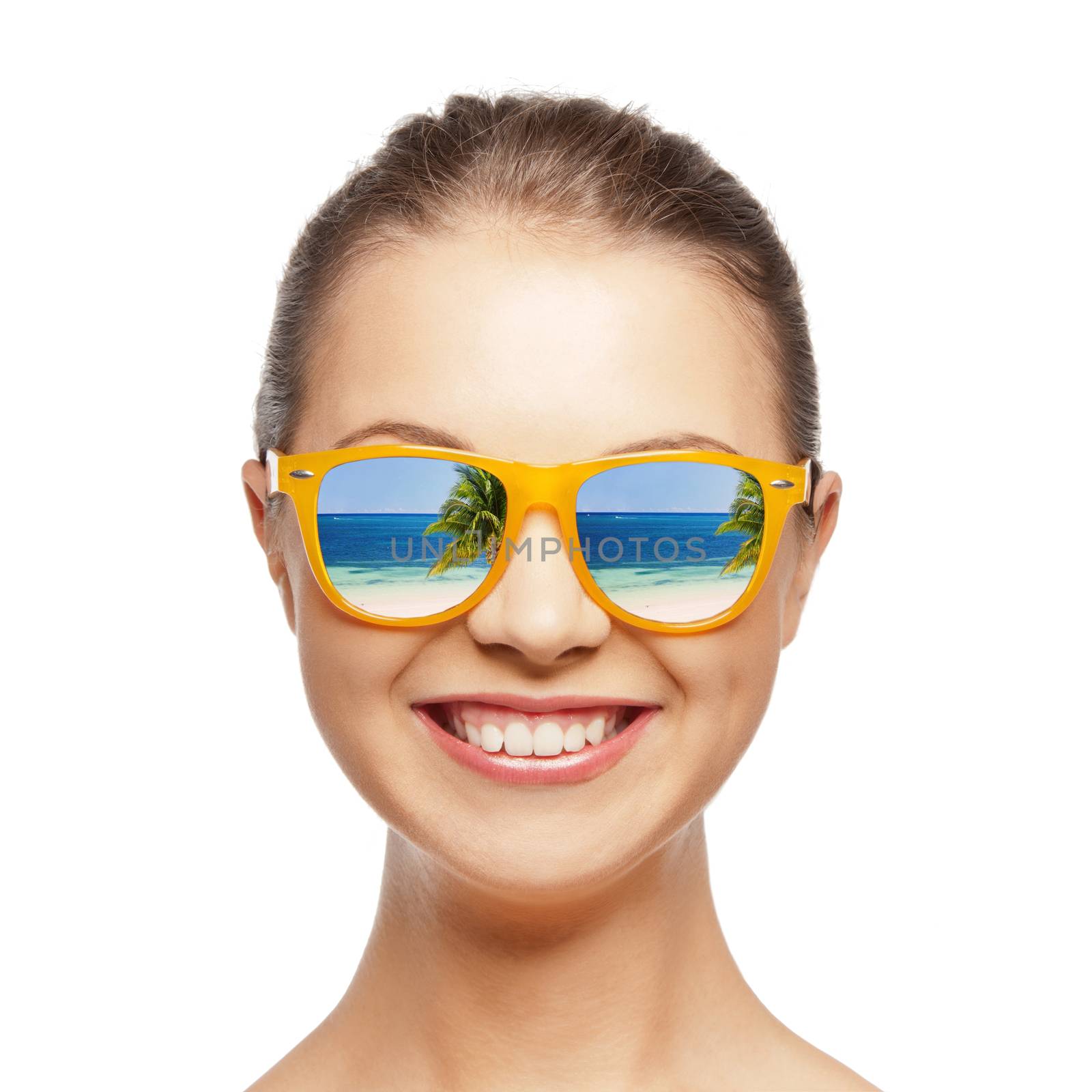 travel, vacation, summer holidays and happy people concept - portrait of happy teenage girl in sunglasses with beach reflection