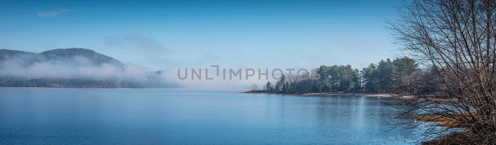 Panoramic - split blue horizon.  Fog lifting off the Ottawa River. by valleyboi63