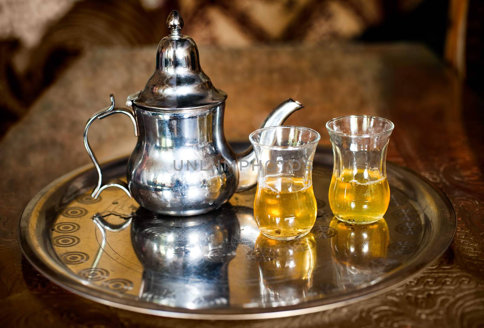 Set of arabic nana mint tea with metal tea pot and glasses