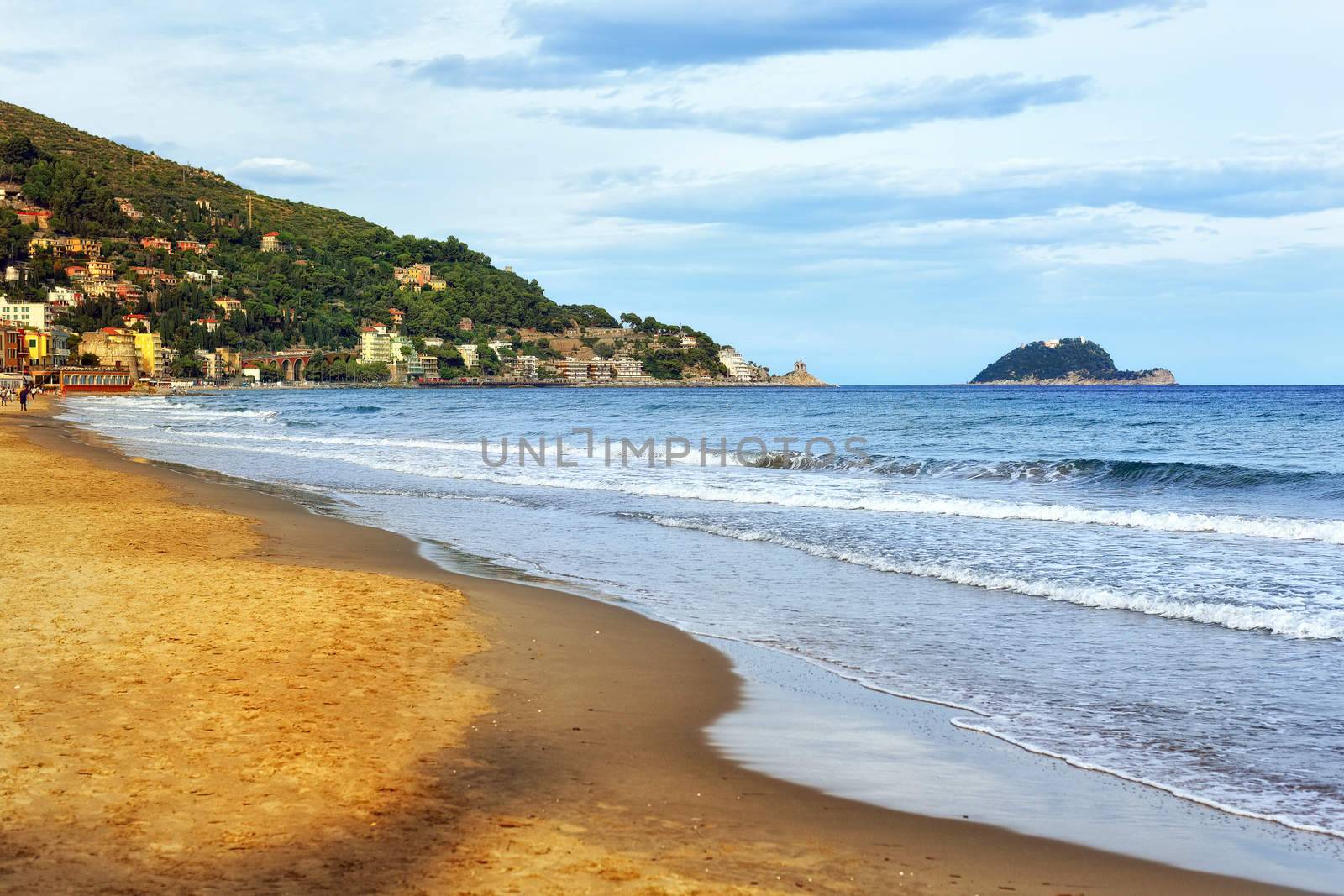 Sand beach on the mediterranean coast of italian Riviera by Imperia, Italy