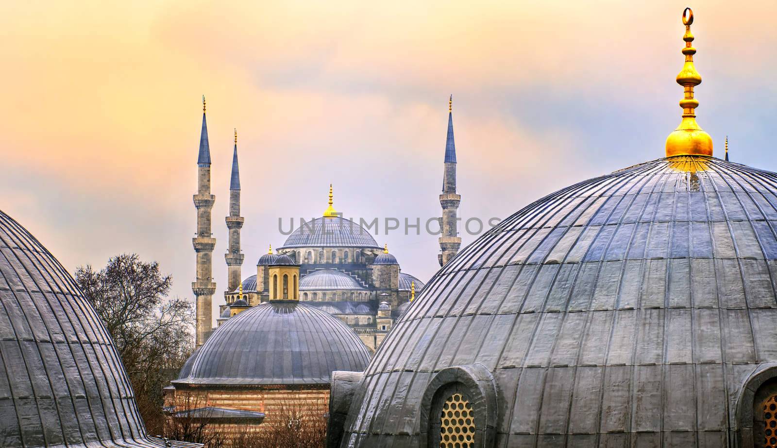 Domes of Blue Mosque in Istanbul on sunset