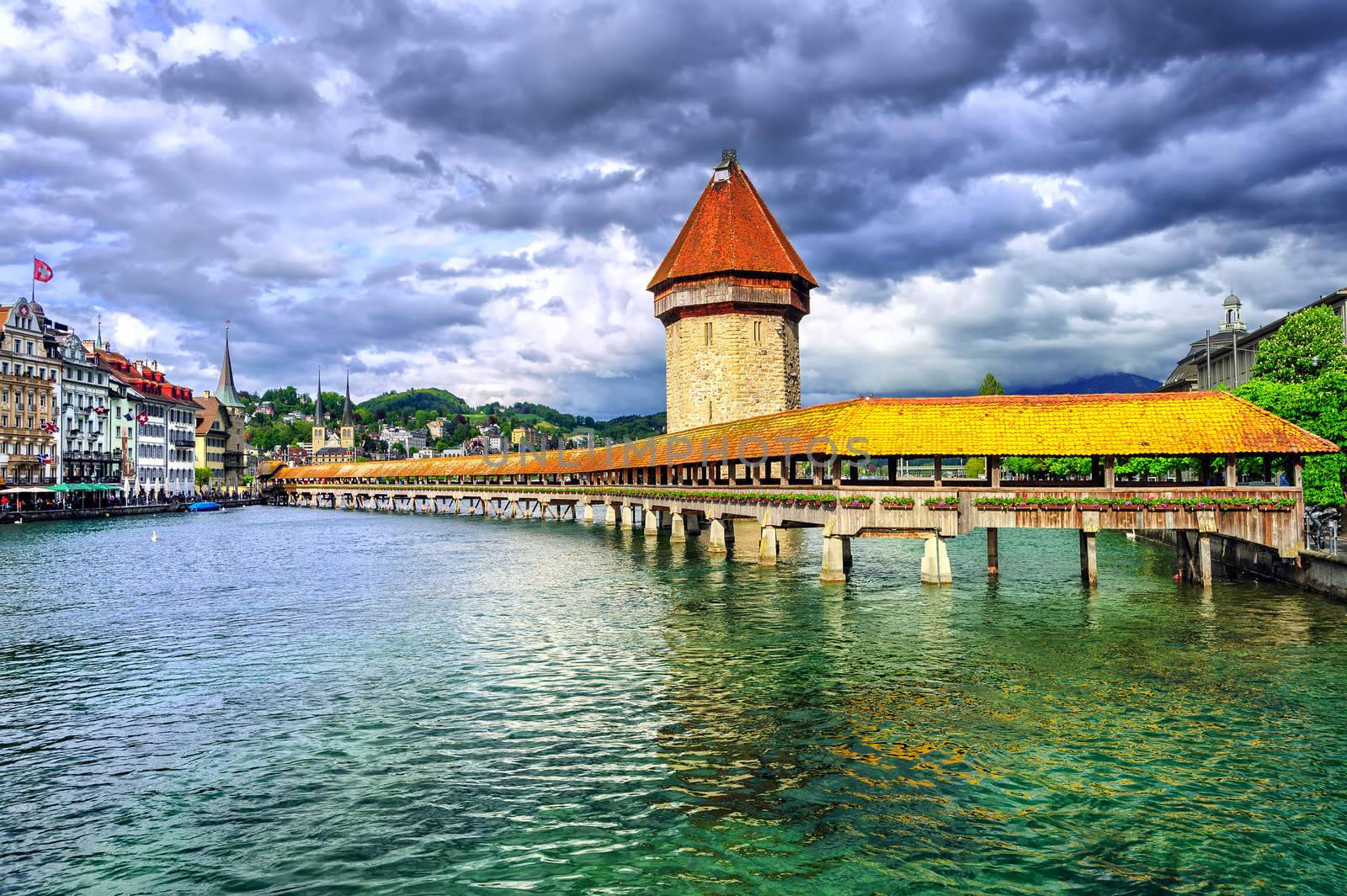 Lucerne, Switzerland, wooden Chapel bridge over Reuss river and Water tower