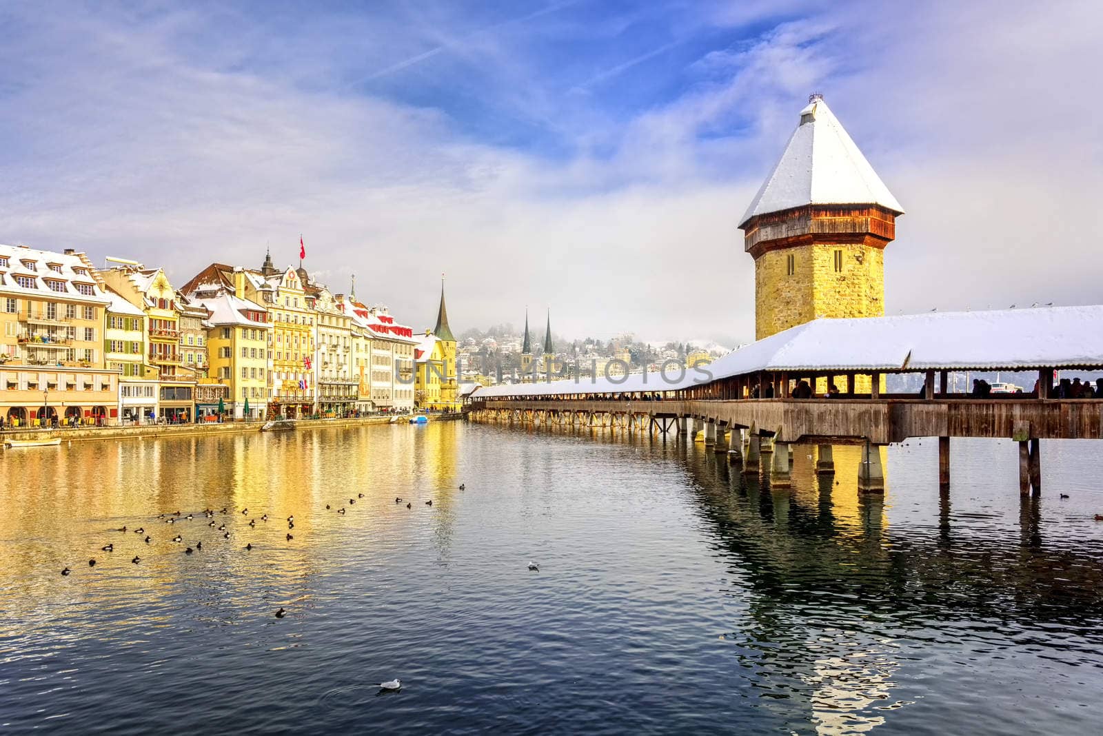 Lucerne, Switzerland, Chapel bridge and Water Tower on a snowy winter day