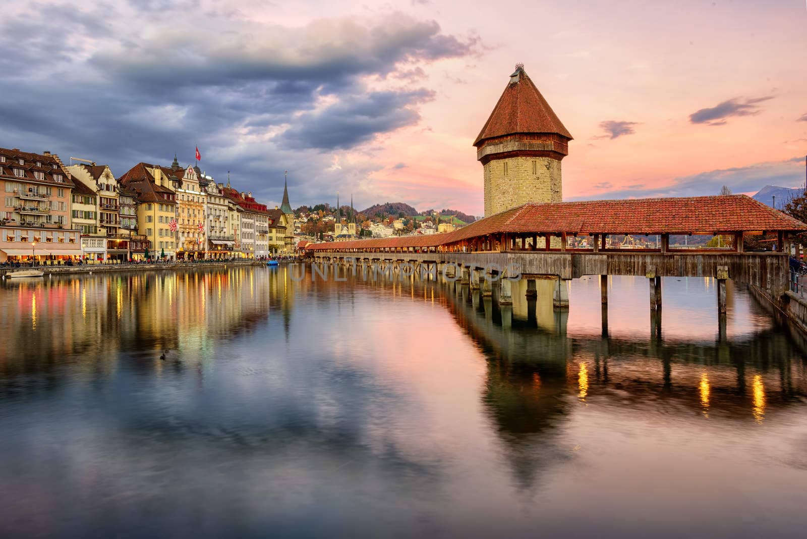Wooden Chapel Bridge and Water Tower on sunset, Lucerne, Switzer by GlobePhotos
