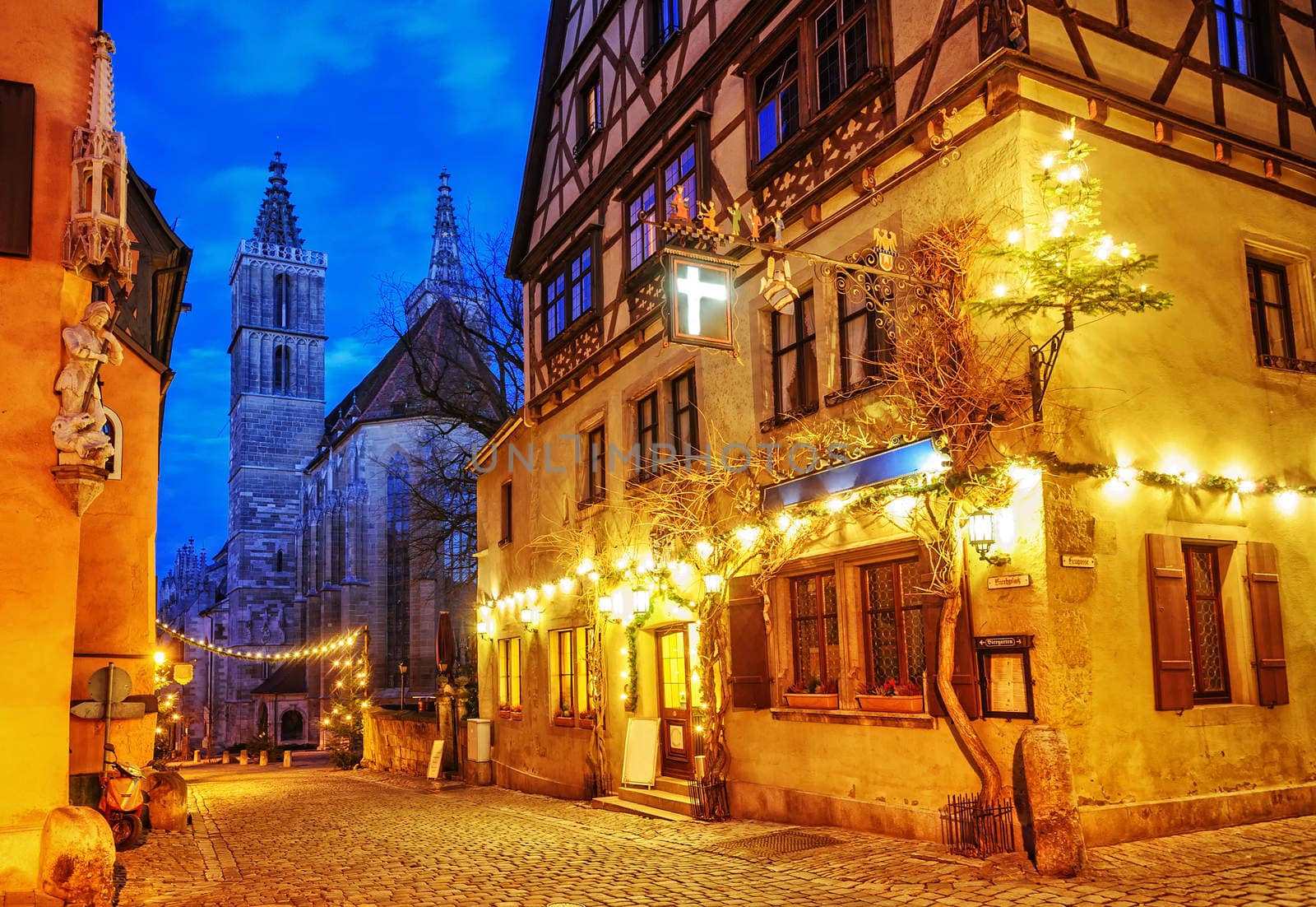 Christmas decoration lights at night in Rothenburg ob der Tauber by GlobePhotos