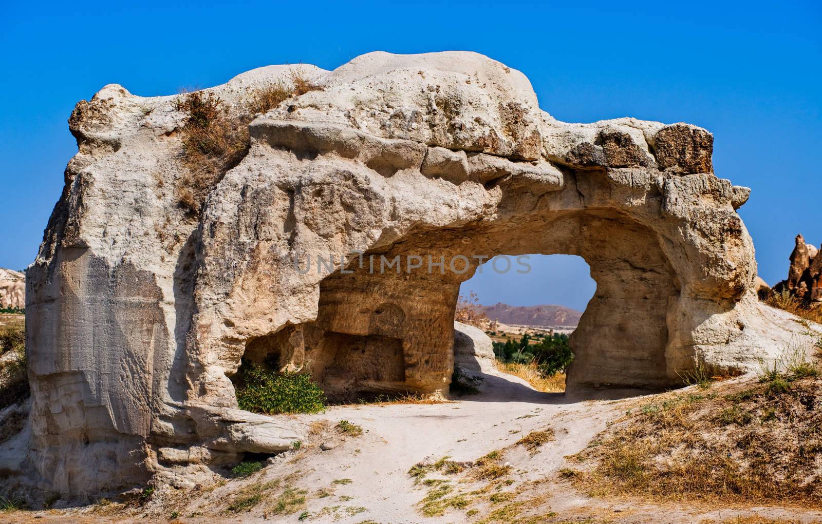 Bizarre hole in a rock formation in Cappadocia, famous tourist destination in central Turkey known for its unique geological landscapes