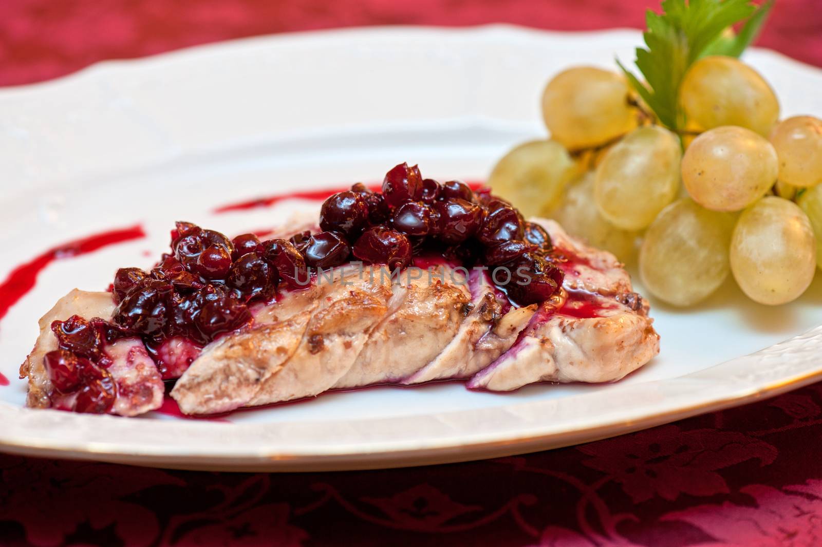 chicken breast meat with cranberry sauce