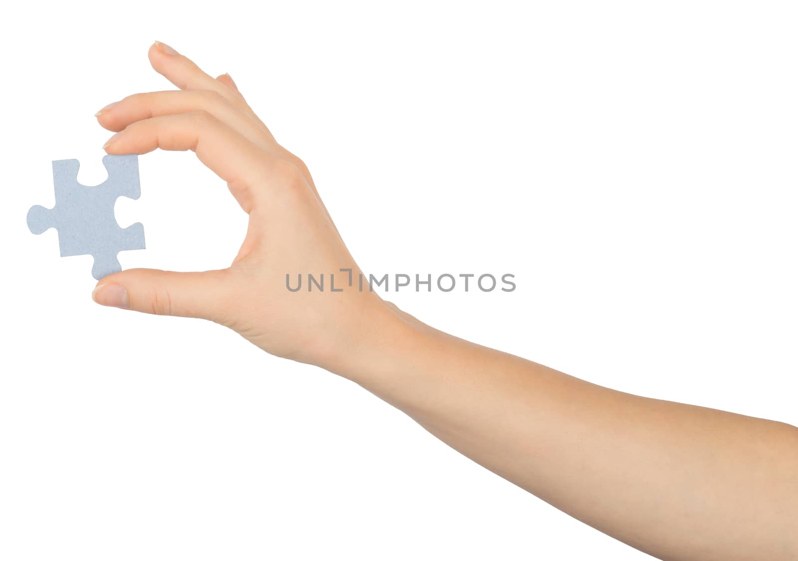 Hand holding puzzle piece on isolated white background