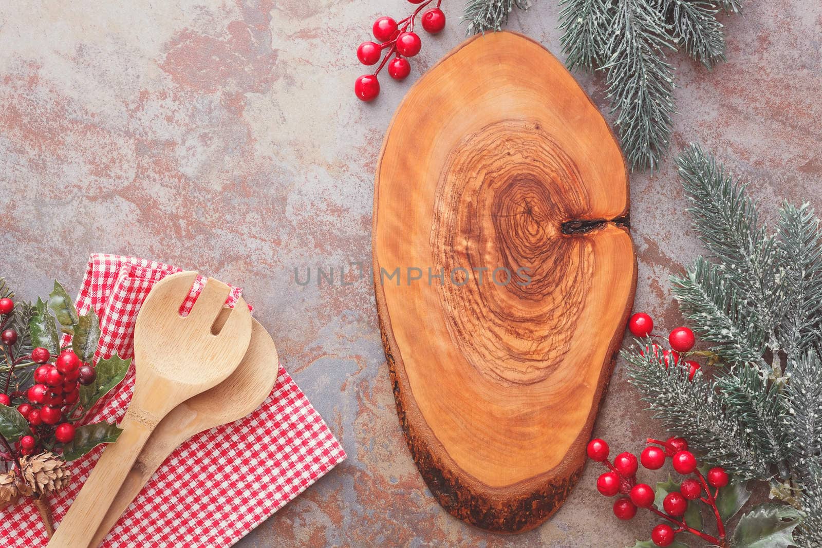 Old wooden kitchen utensils and cutting board on rustic table, Christmas cooking concept. Top view, vintage style, blank space
