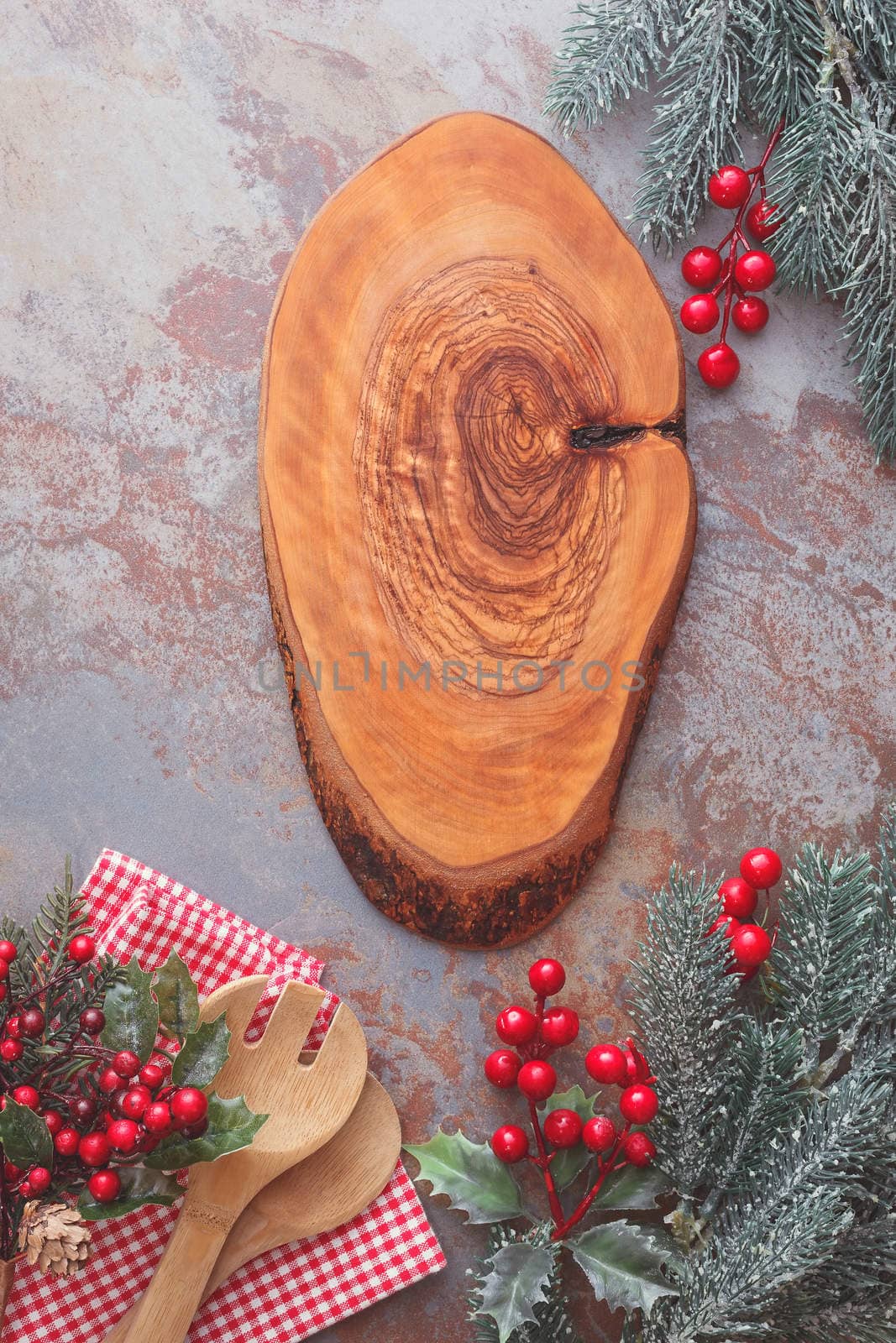 Old wooden kitchen utensils and cutting board on rustic table, Christmas cooking concept. Top view, vintage style, blank space