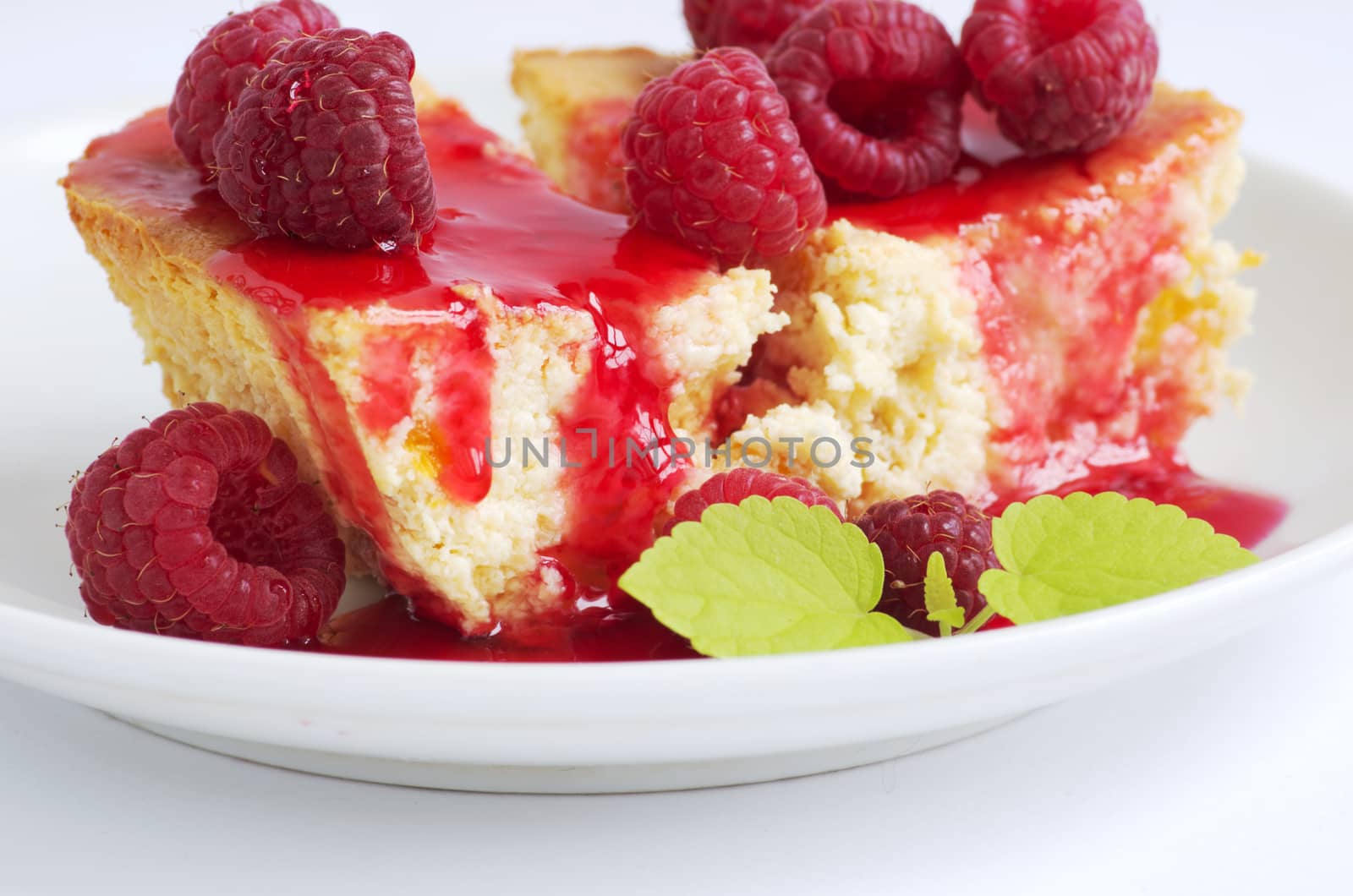 cake with raspberries and cream cheese decorated with fresh rasp by dolnikow