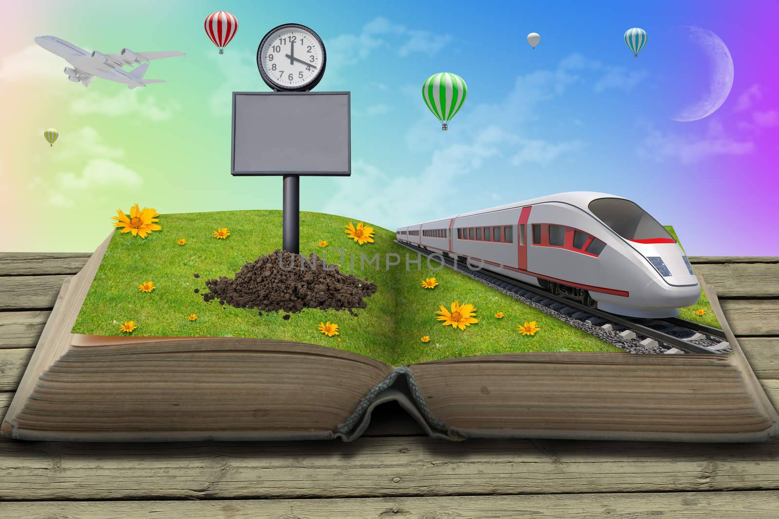 Train on open book with green grass and flowers