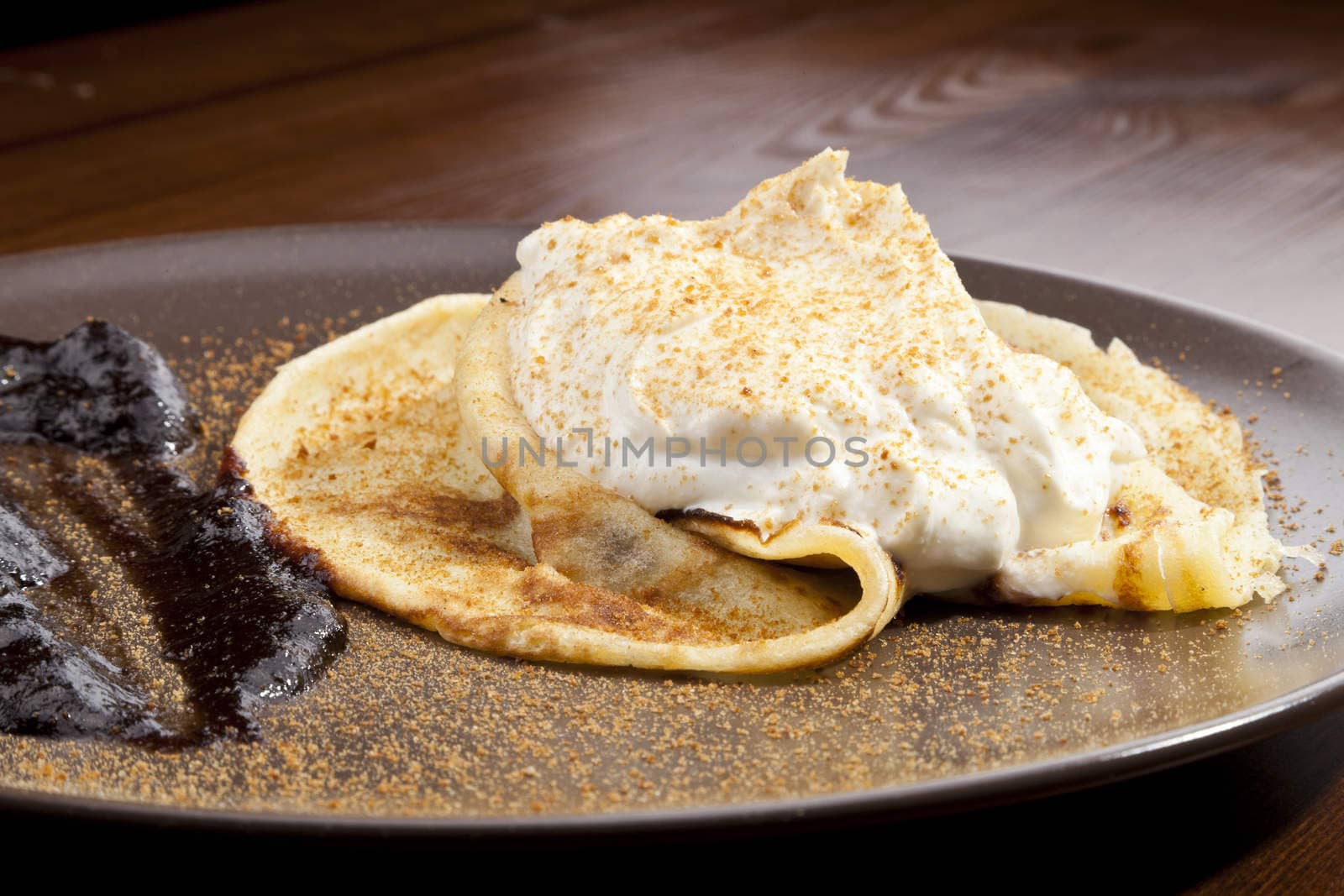 Crepe pancake with whipped cram and gingerbread powder