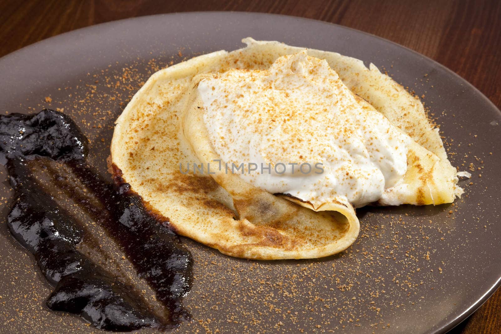 Crepe pancake with whipped cram and gingerbread powder
