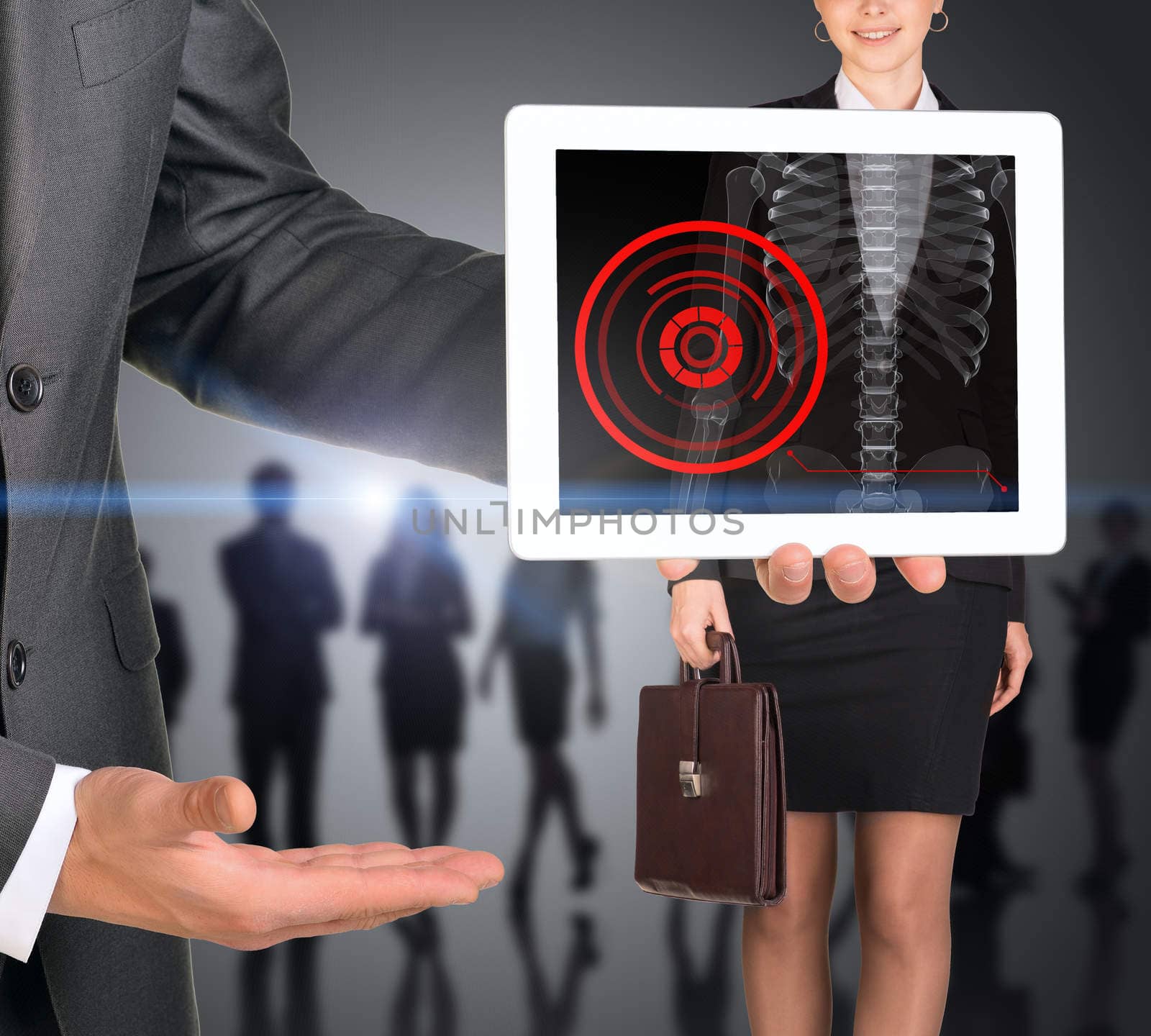 Businessman holding tablet with x-ray of woman