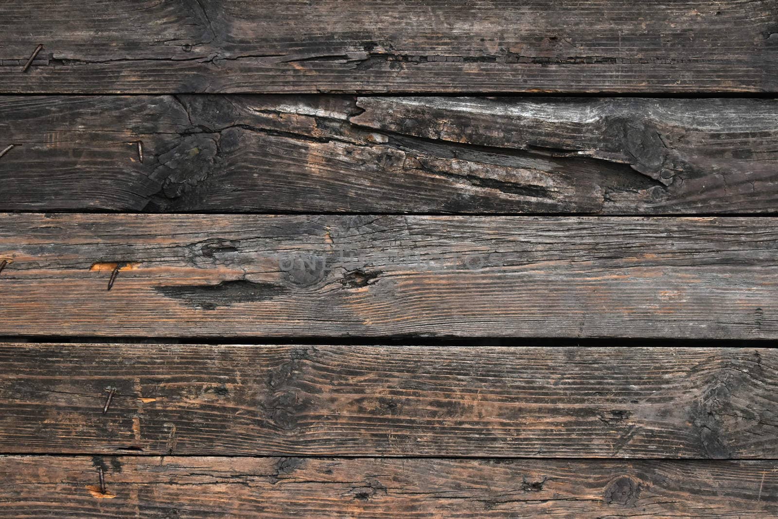 Old dark vintage rustic aged antique wooden sepia panel with horizontal gaps, planks and chinks