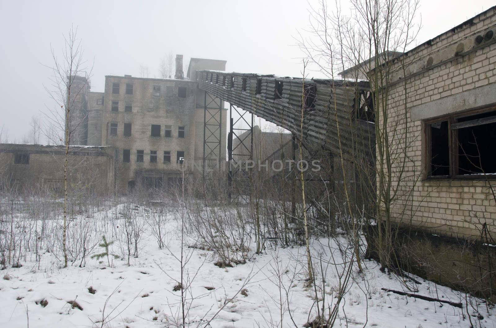 Desolate industrial soviet factory in winter time