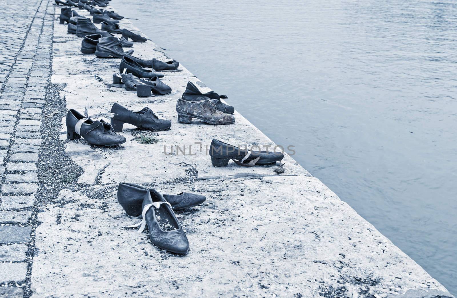 BUDAPEST, HUNGARY - October 12: Iron shoes memorial to Jewish people executed WW2 in Budapest Hungary on October 12, 2015