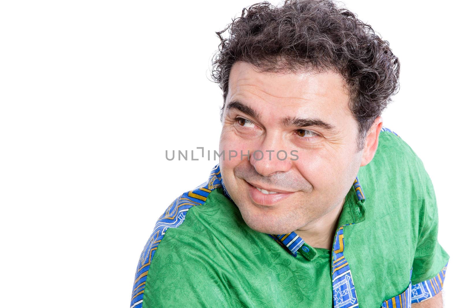 Close up Middle Aged Man Wearing African Shirt, Looking Sideways with Smiling Face Against White Background.