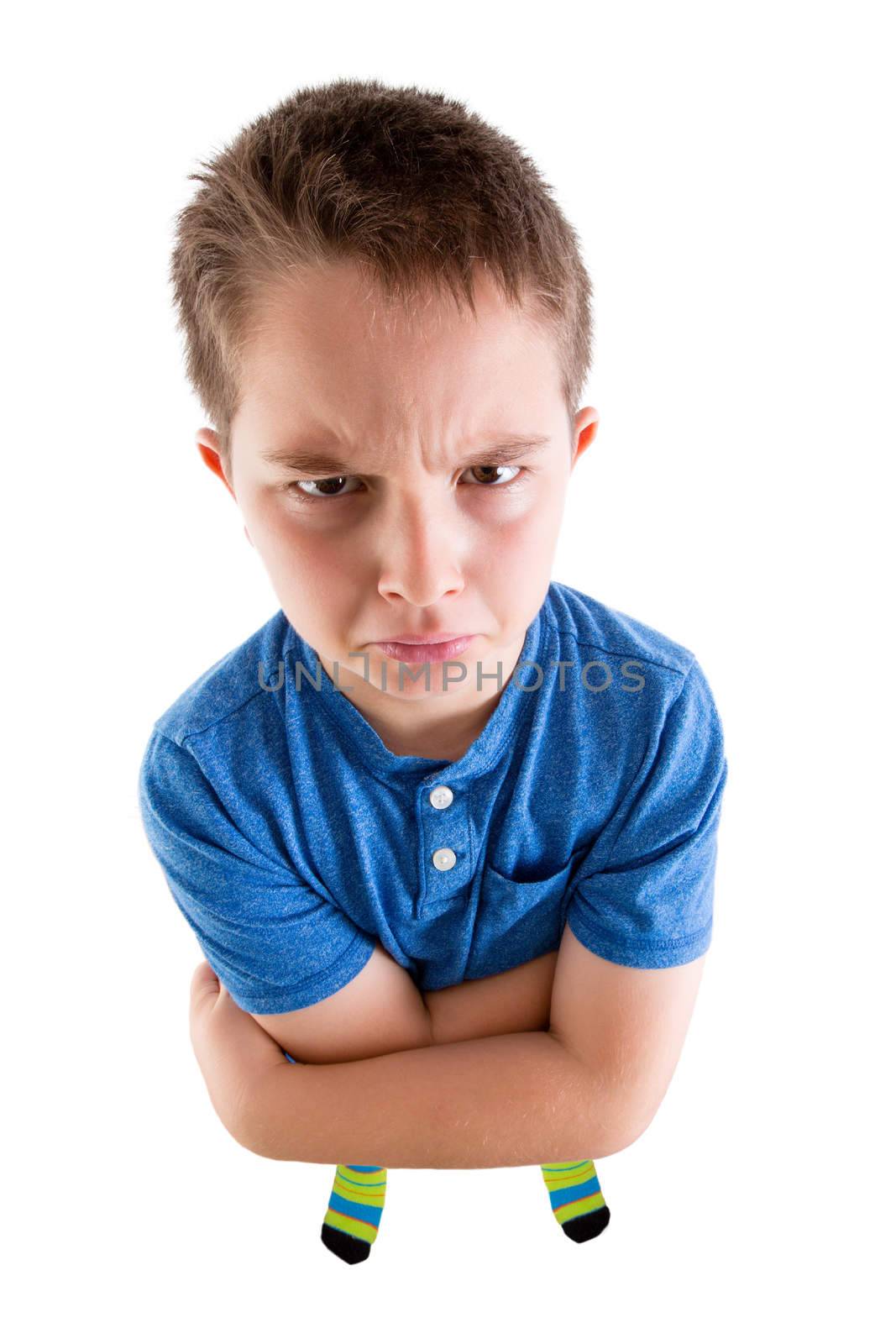 Young Boy Looking at the Camera From High Angle View with Mean Facial Expression. Isolated on White Background.