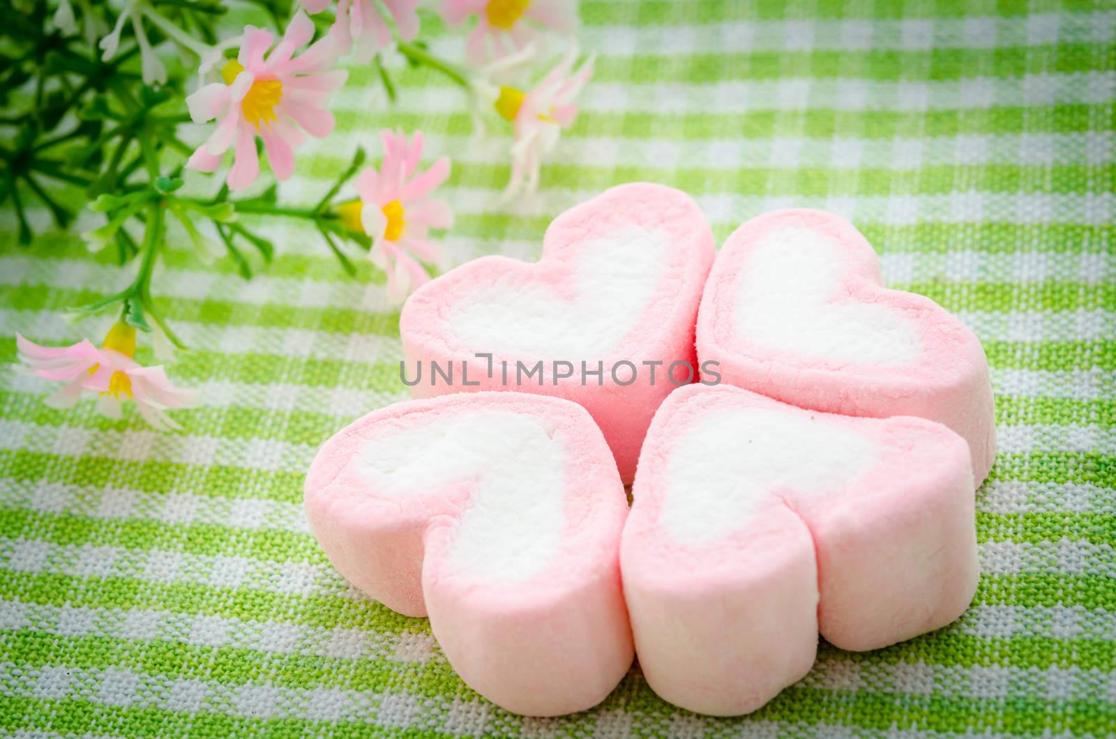 Pink marshmallow heart shape. by Gamjai